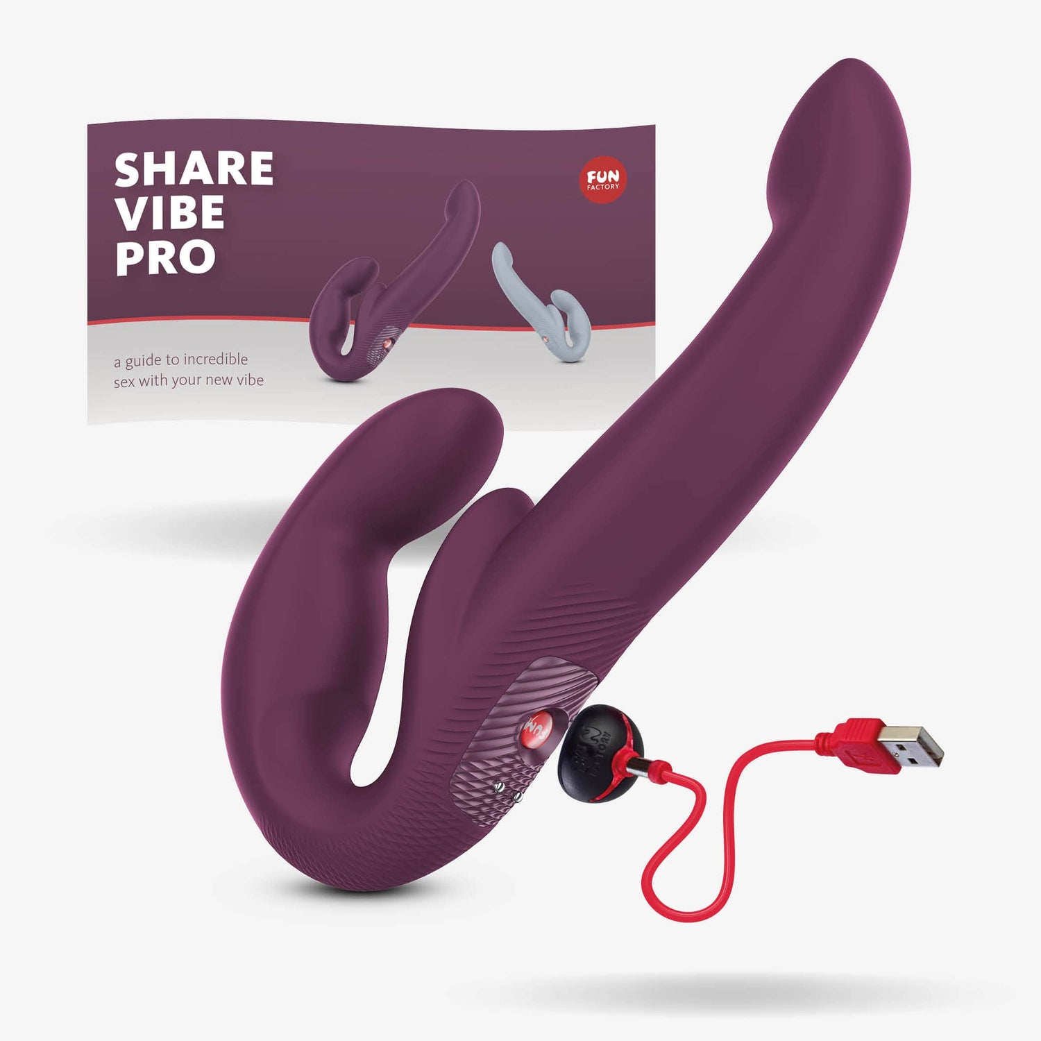 Share Vibe Pro double dildo with the charger and user manual on a grey background