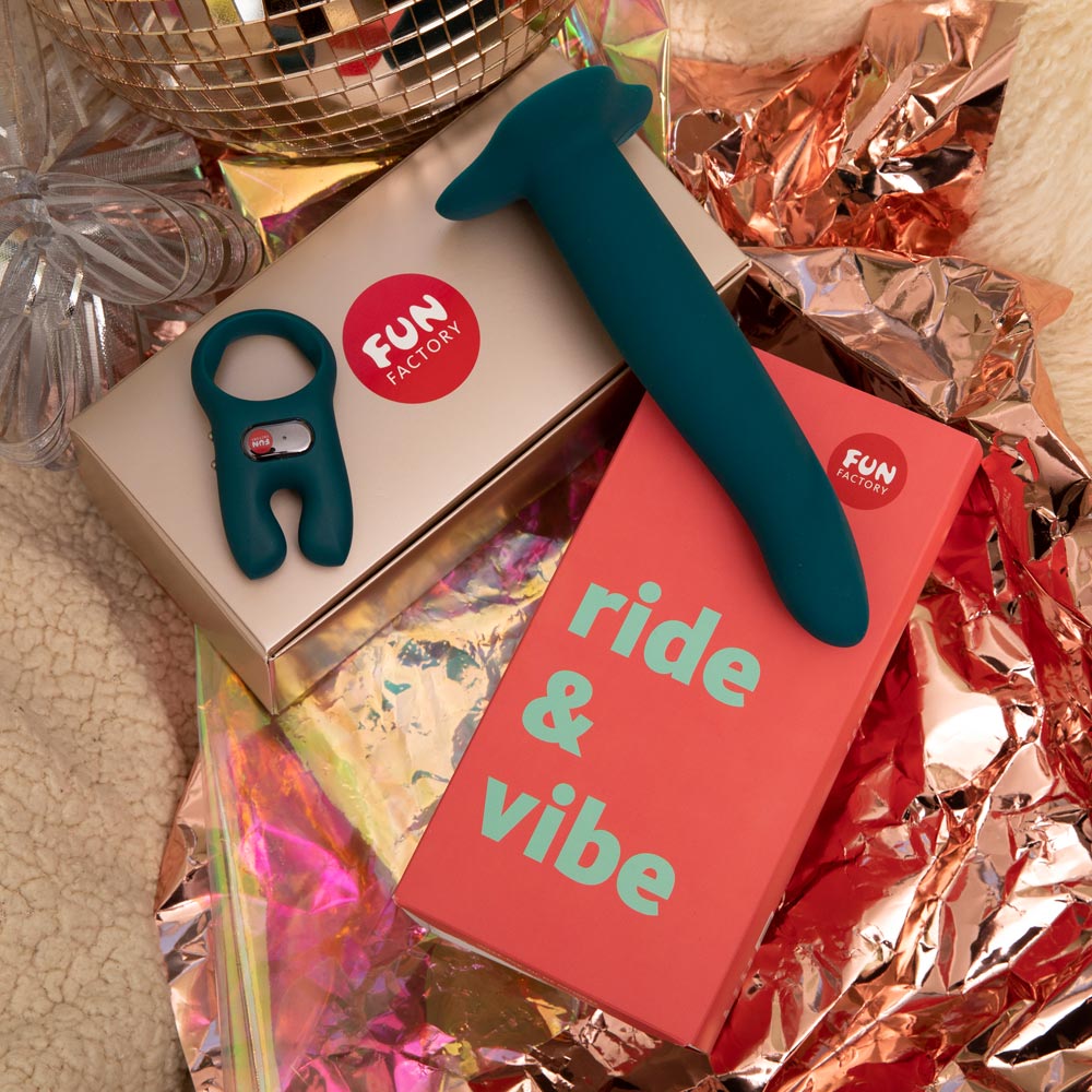Ride and Vibe kit by Fun Factory with the open package on a festive background