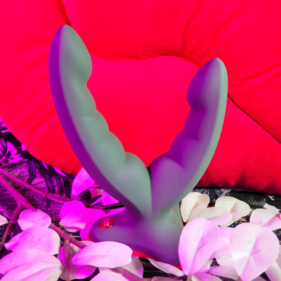 Ryde grinding dildo by Fun Factory shot next to flowers petals 