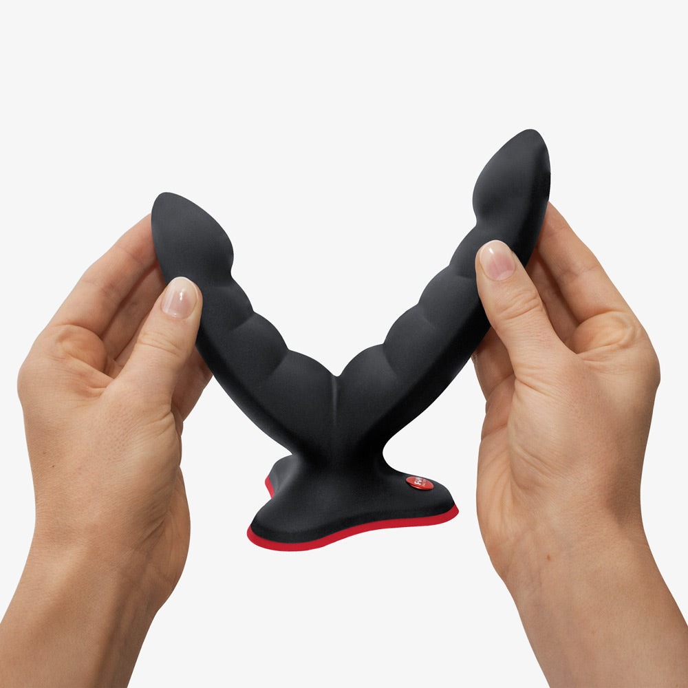 Ryde grinding dildo by fun factory in black being stretched