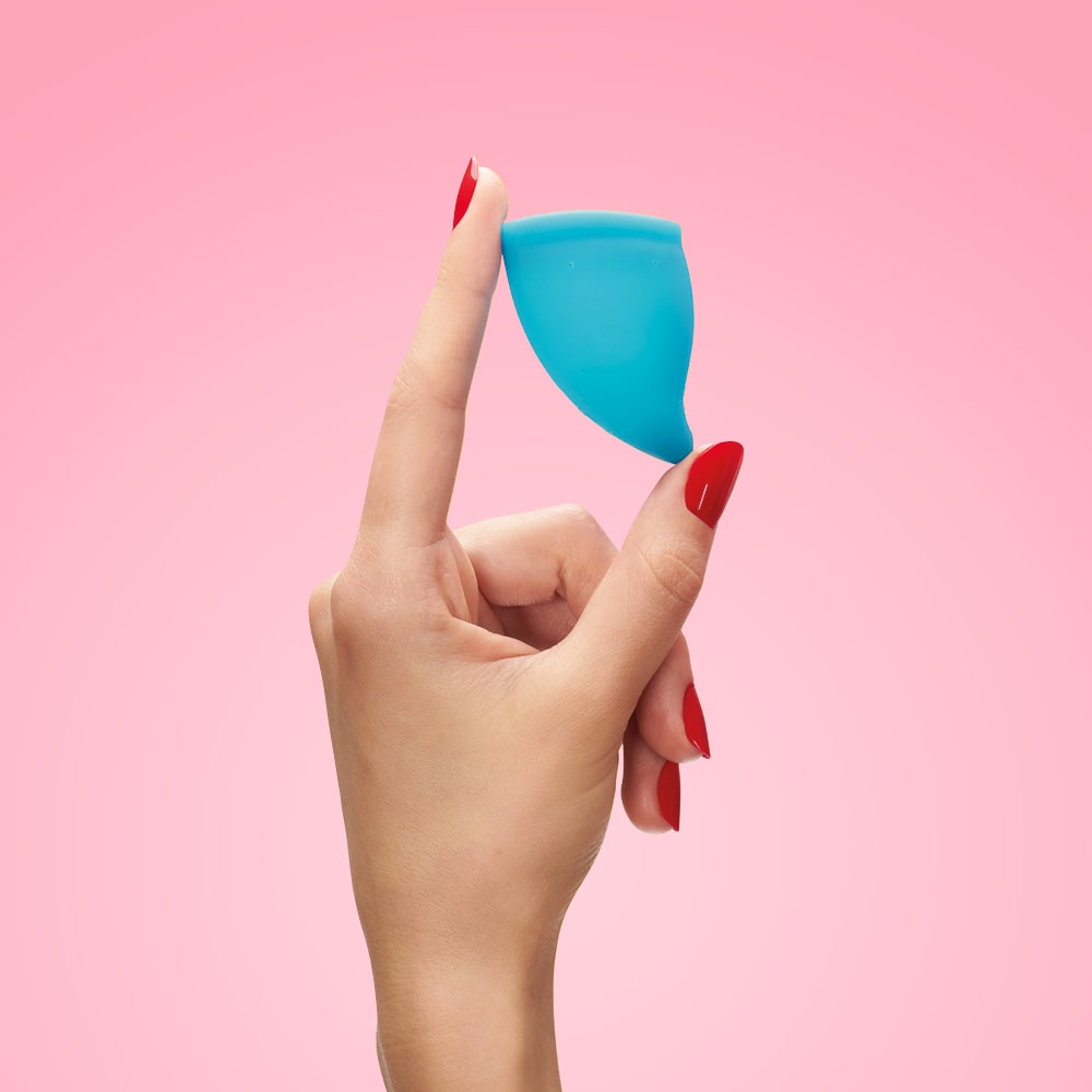 https://us.funfactory.com/cdn/shop/products/FUN-CUP-SIZE-A-turquoise_Menstrual-Cup-Handshot-min.jpg?v=1614799354&width=1445