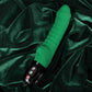 Emerald TIGER vibrator on green velvet