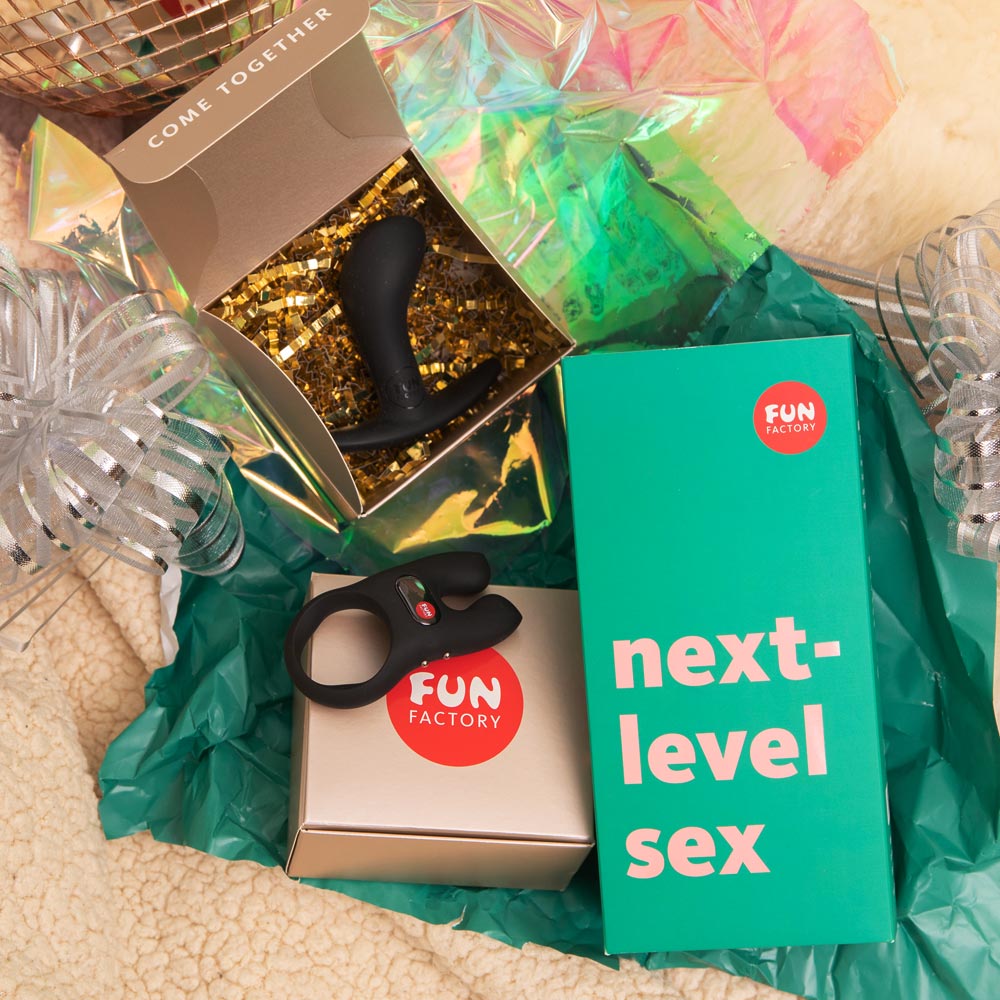 Next-level Sex kit by Fun Factory with the open package on a festive background