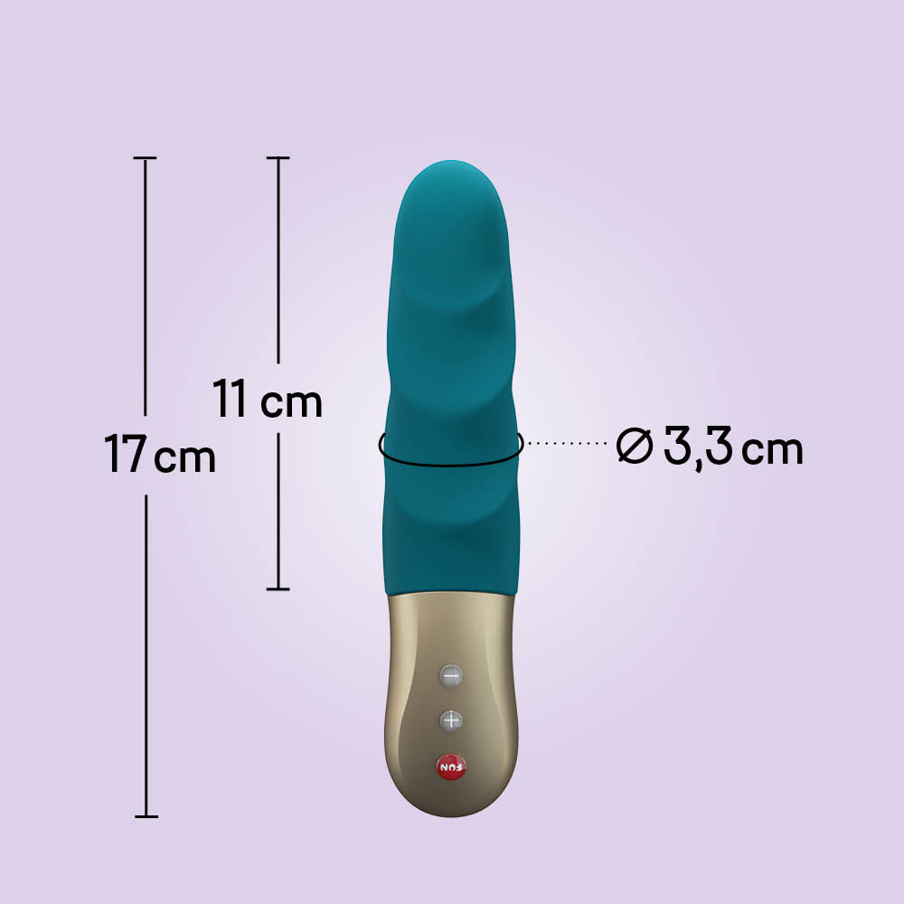 Stronic Petite by Fun Factory in deep sea blue on a lilac background with measurement reference