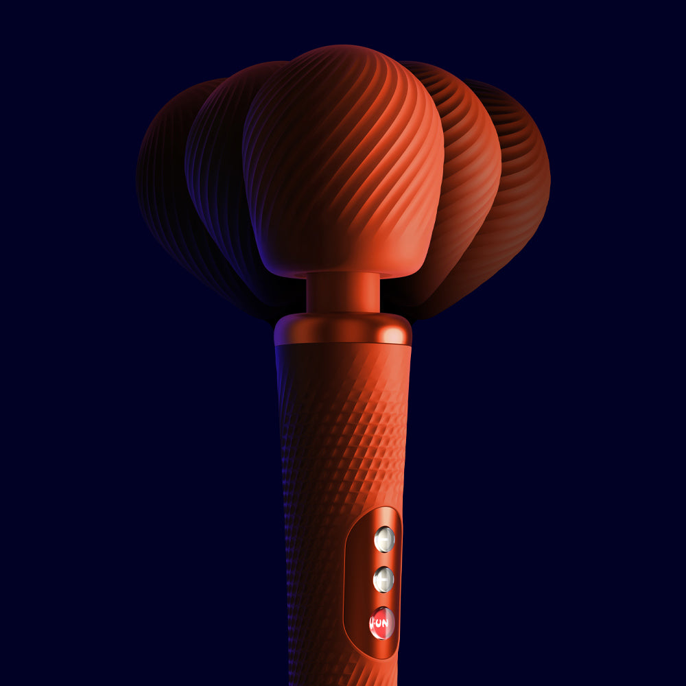 Wand Vibratory by Fun Factory in orange showcasing the head motions on an orange background