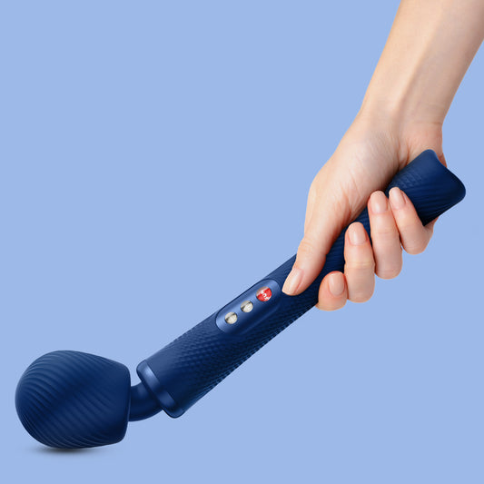 Wand Vibratory by Fun Factory in blue held in hand on a blue background